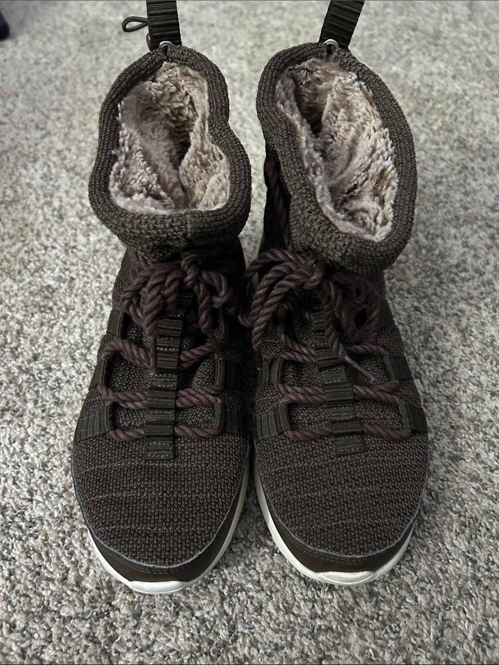 Nike Roshe One high-top sneaker boots with a plush faux fur lining for warmth.